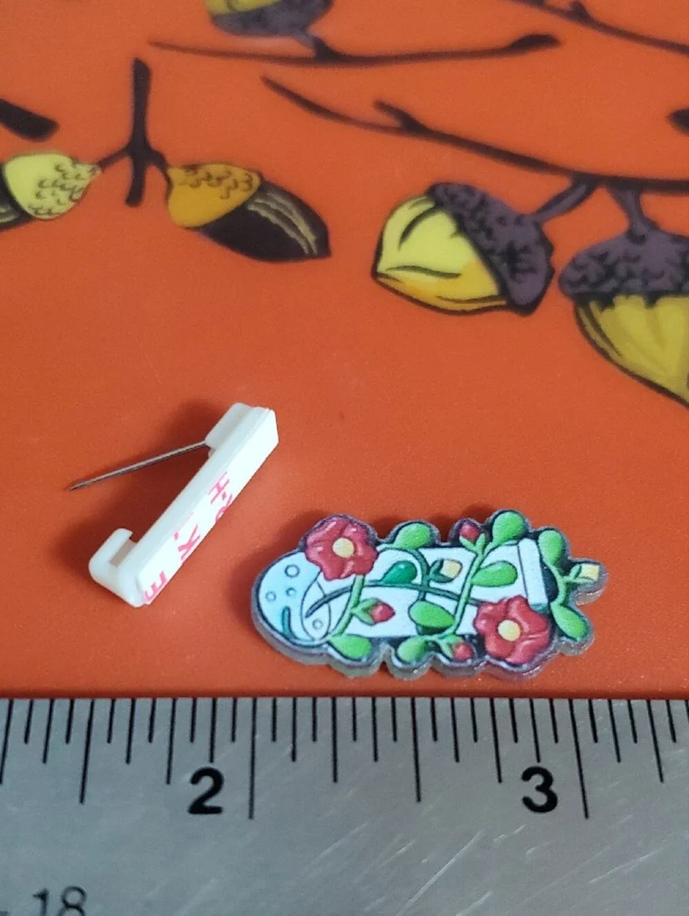 Floral Potion Acrylic Pin in Red, Green, White